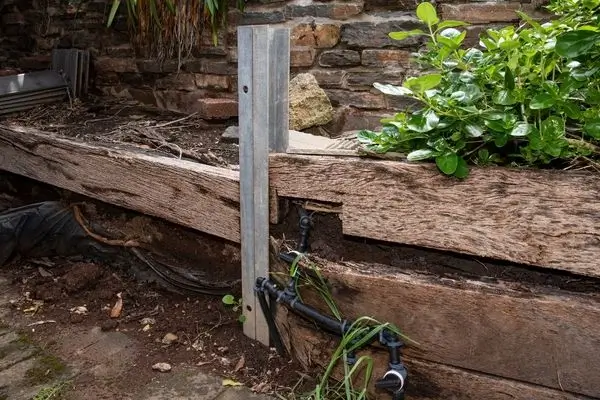 damaged timber sleeper retaining wall